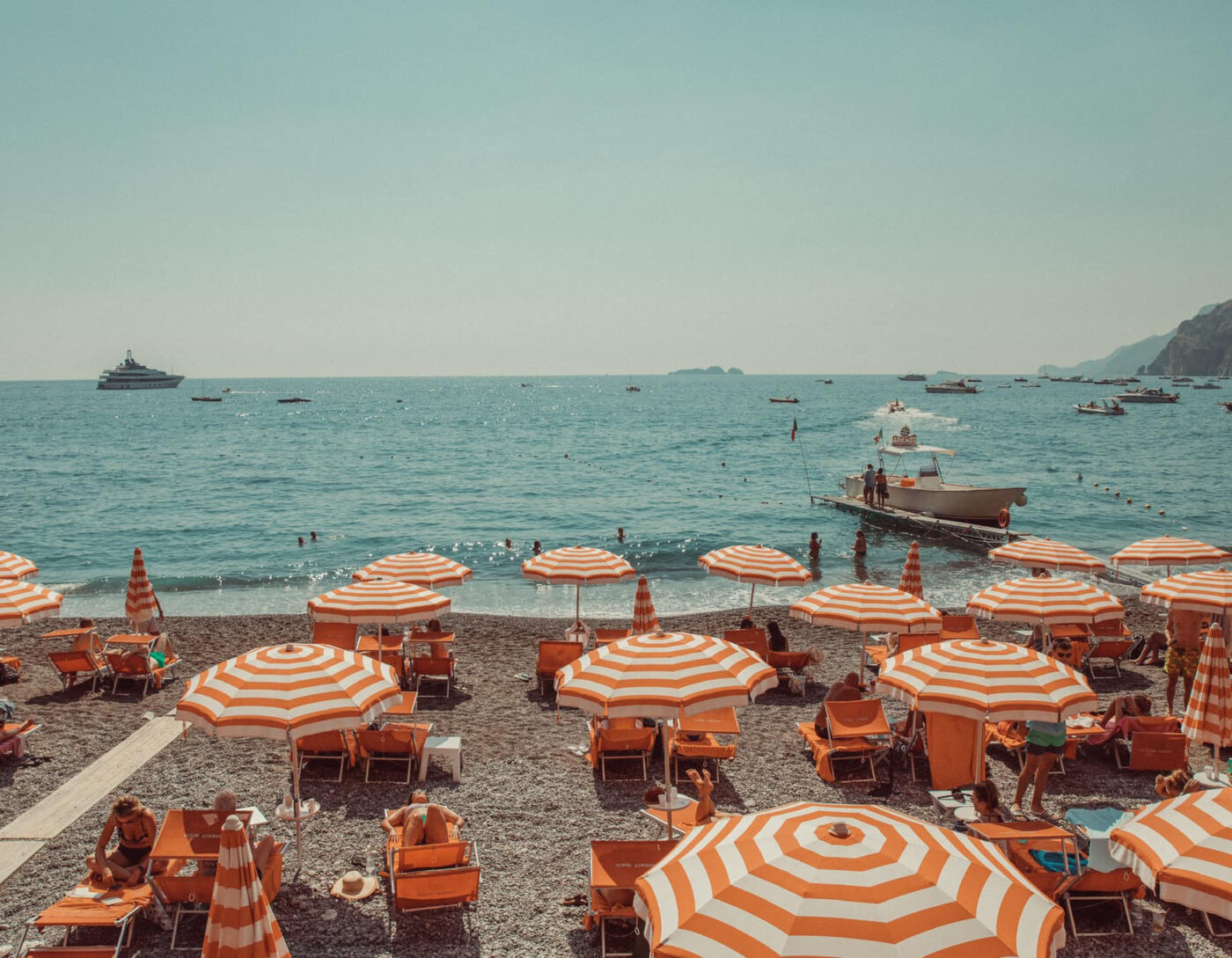 Orange parasols at Arienzo Beach Club