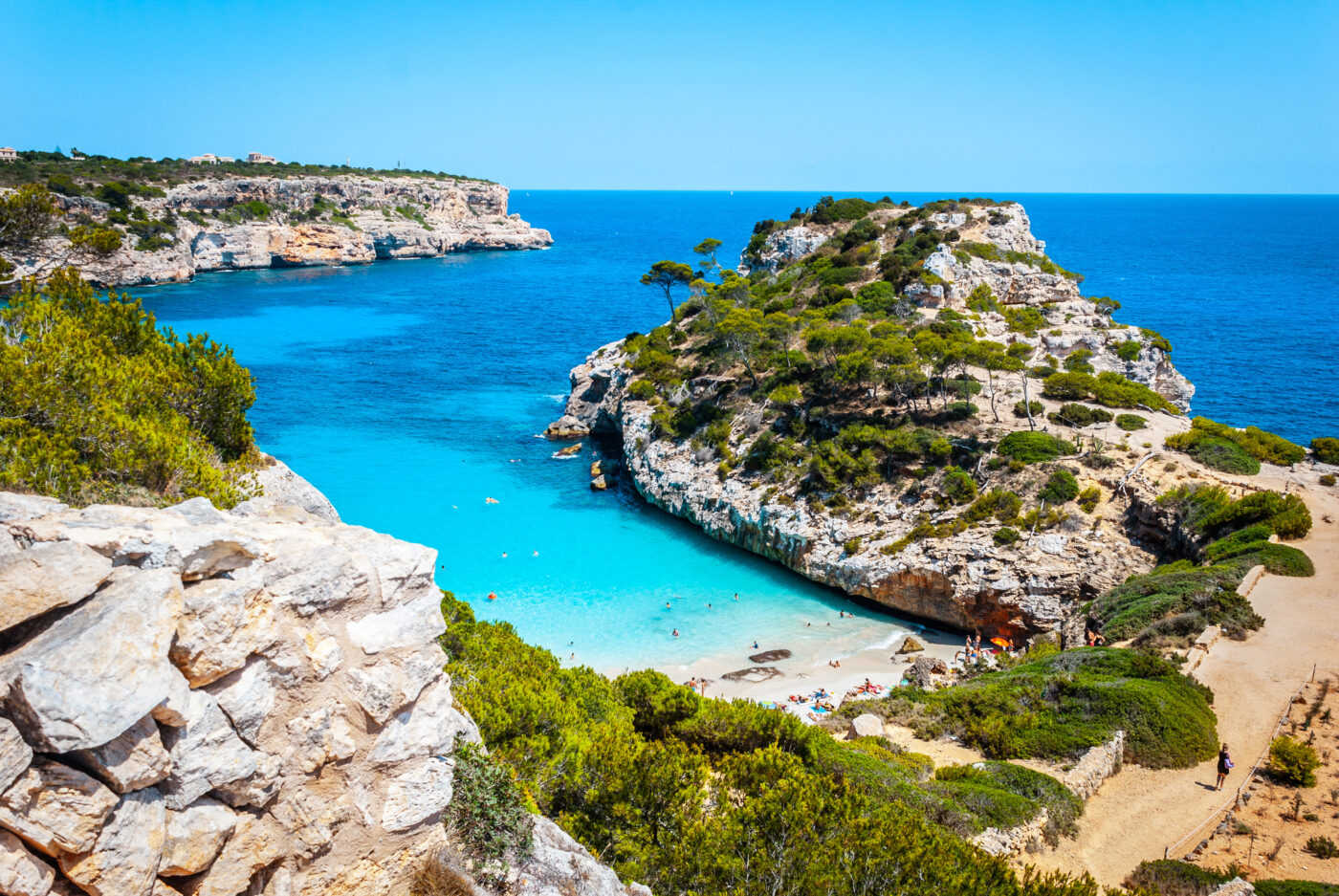 Cala des Moro, an empty beach with turquoise water and cliffs