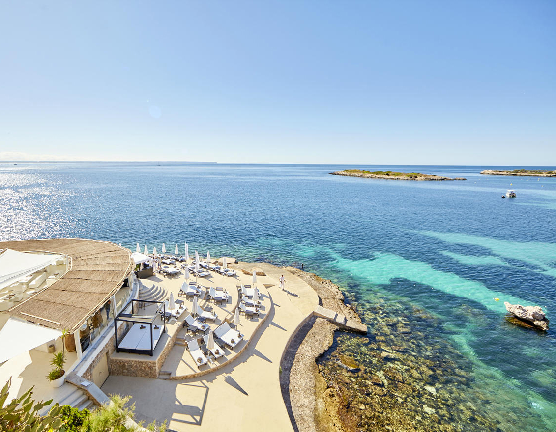 Purobeach Illetes with white sun loungers and sea views