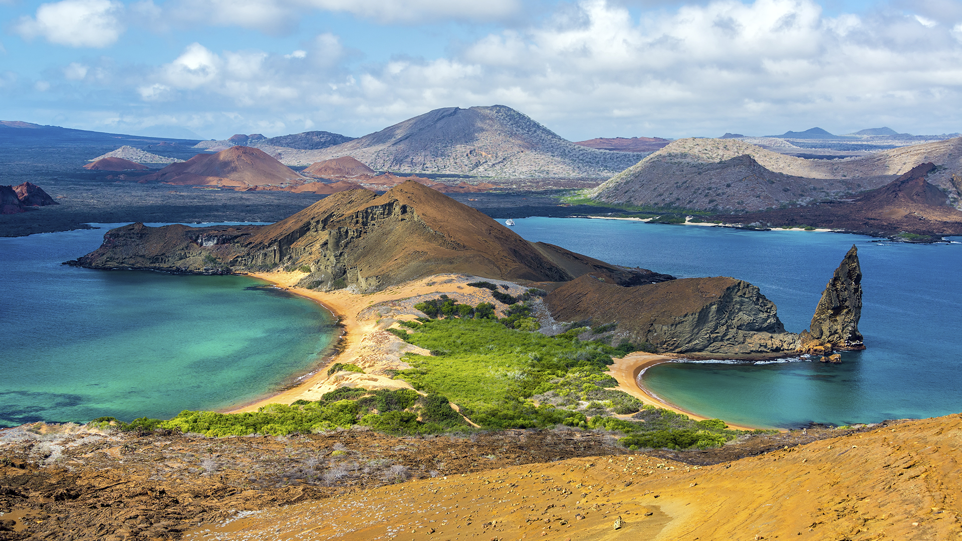 Galapagos Islands scenery with rugged volcanic hills and vibrant blue waters