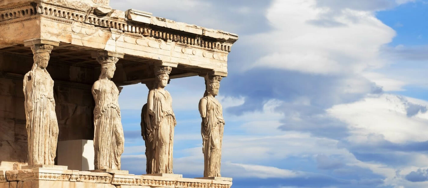The image shows the Caryatids porch of the Erechtheion temple on the Acropolis of Athens, Greece.