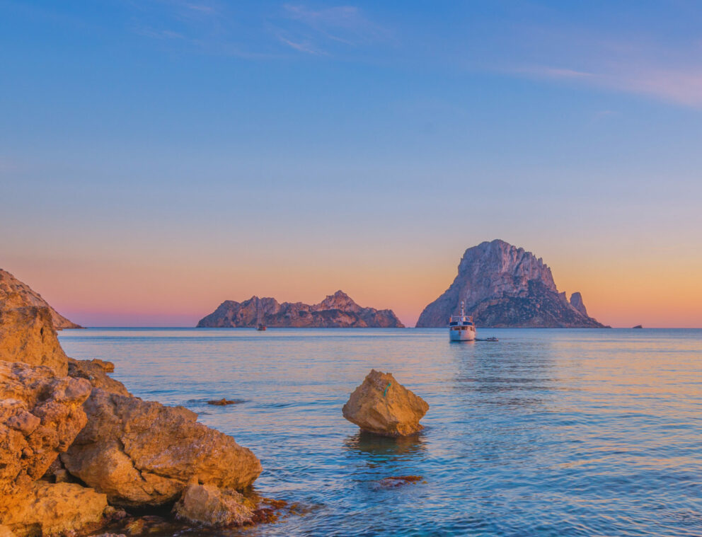 Sunset at Es Vedrà with a yacht in the distance