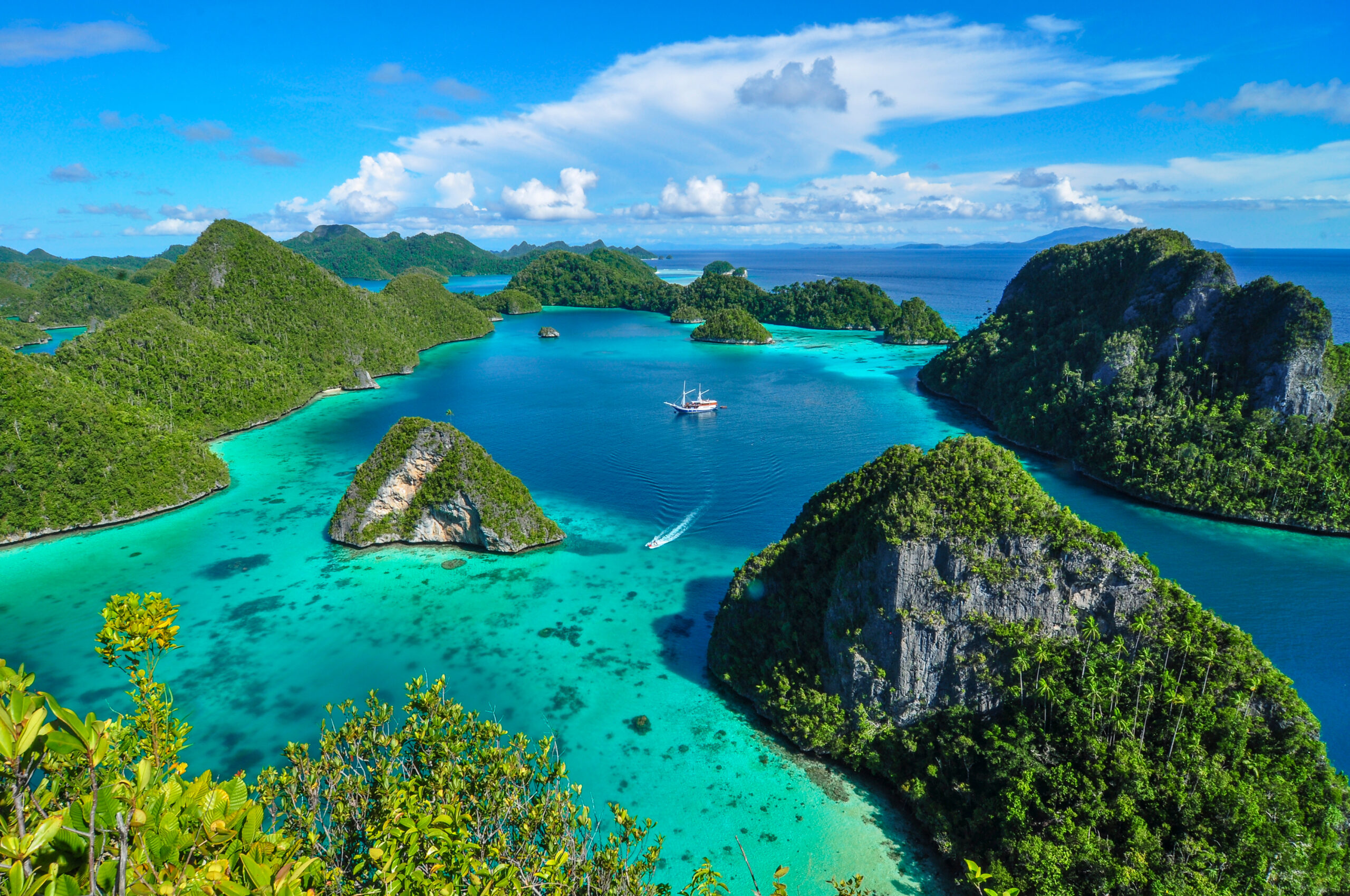 Aerial view of the iconic Wayag islands in Indonesia with emerald lagoons.