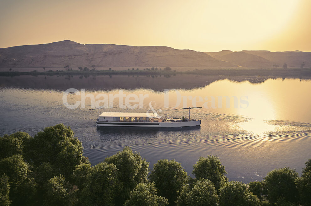 Berge Yacht Nile Egypt, cruising at sunset